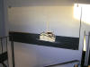 akrylmålning av fiskebåt i trapphuset Norelund Hedemorabostäder